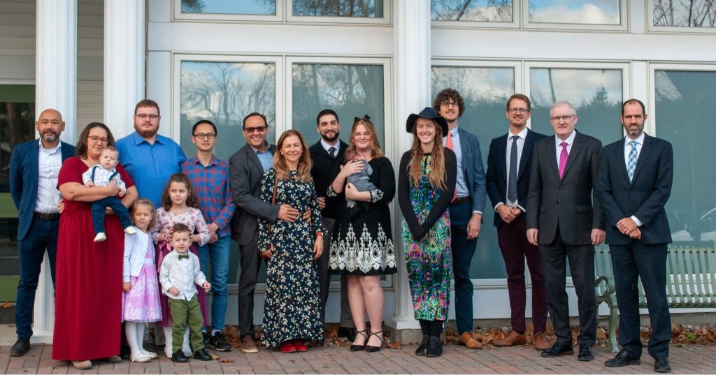 group of people in front of the church building.